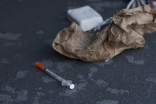 Dirty Drug Addict Needle Discarded On City Sidewalk