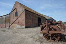 Agricultural Shed Building And Vintage Farm Machinery In Rural Norfolk.
