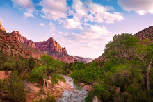 Beautiful Mountain Landscape At Sunset . Red Mountains And Fiver Flowing In The Valley. Zion National Park , UTAH, USA.