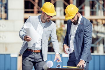 Wall Mural - Two architects works in front of building site