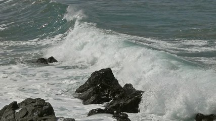 Wall Mural - Splashes from atlantic ocean big waves over cliffs, slow motion