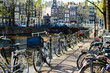 Traditional dutch bicycles parked on the bridge in Amsterdam, th
