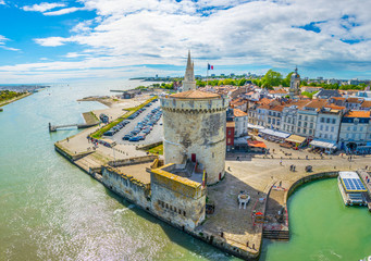 seaside of la rochelle dominated by tour de la lanterne and tour de la chaine, france