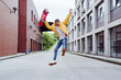 © ADDICTIVE STOCK - Happy and excited teenager jumping with skateboard