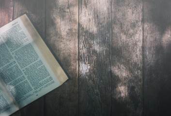 Soft focus The holy bible on wood table with copy space.christian background