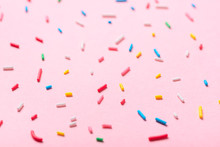 Sugar Colorful Sprinkles Over Pink Background