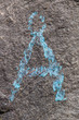Å A character written on the grey wall with blue paint, Norway
