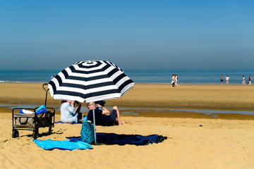 enjoying life. people relaxing on the sandy beach during vacatio