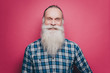 © Maskot - Portrait of smiling senior man with long white beard against pink background