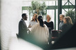 © Maskot - Multi-ethnic business people standing at office