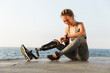 © Drobot Dean - Smiling disabled athlete woman with prosthetic leg