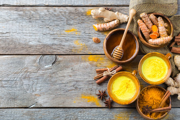 Traditional indian drink turmeric curcuma golden milk with ingredients