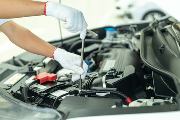 Auto mechanic working in garage, Car Repair Service center.