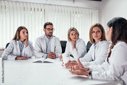 Fotomural Medical professional during the meeting in the conference room.