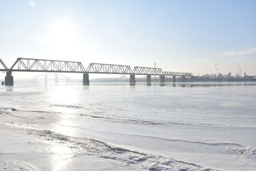  bridge on a frozen river on a sunny day