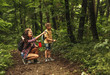 © BalanceFormCreative - Mother and her little sons  hiking trough forest .Watching birds.