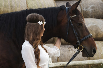 Wall Mural - Cute young woman and her beautiful horse