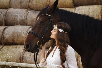 Wall Mural - Cute young woman and her beautiful horse