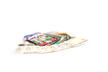 British pound, oyster card and credit card on white background.