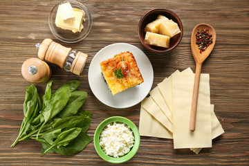 Sticker - Composition of tasty lasagna with spinach on wooden background