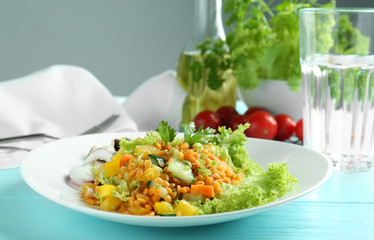 Canvas Print - Plate with delicious lentils salad on wooden table