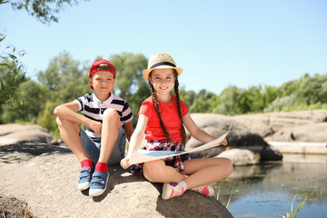 Wall Mural - little children with map outdoors. summer camp