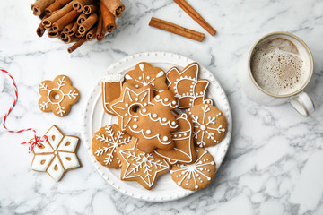 Poster - Plate with tasty homemade Christmas cookies and cup of coffee on table, top view