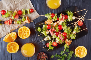 Poster - antipasto skewers on a black plate