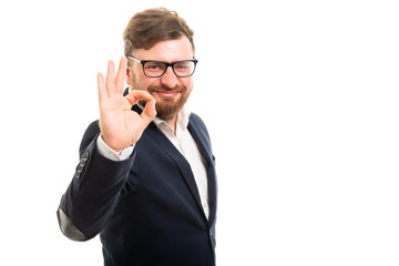 Wall Mural - Portrait of business man showing ok gesture.