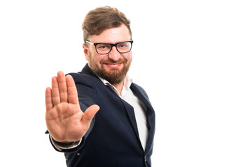 Wall Mural - Portrait of business man showing stop gesture.