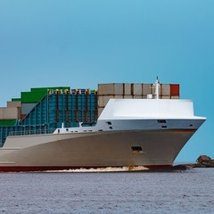 Grey container ship underway