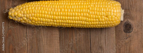 banner corn on the wooden background