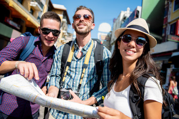 Group of tourist backpacker friends traveling in Khao San road Bangkok Thailand on summer vacations