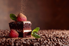 Closeup Of Chocolate Cake With Raspberry And Mint .