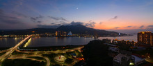 Panorama Of The Tamsui And Bali Districts Along The River In New Taipei City At Sunset With A Crescent Moon And The Planet Venus Rising Above Mount Guanyin