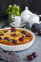 Canvas Print - Homemade almond and cherries cake, baked cream with honey and peaches and prunes