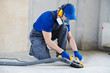 © Kadmy - concrete floor surface grinding by angle grinder machine