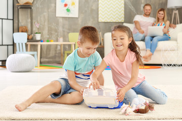 Canvas Print - Cute little brother and sister playing at home