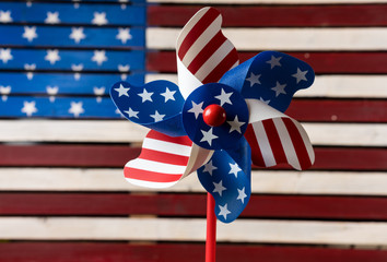 Pinwheel or whirligig in front of US flag