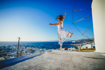 Canvas Print - Woman tourist in Mykonos, Greece