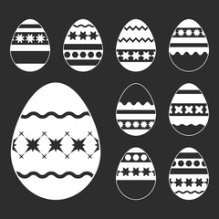 Wall Mural - Set of white isolated Easter eggs on a black background. With an interesting abstract pattern. Simple flat vector illustration. Suitable for decoration of postcards, advertising