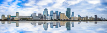 Panorama Of Canary Wharf Business District With Water Reflection