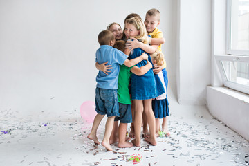 happy hugging children on the white background