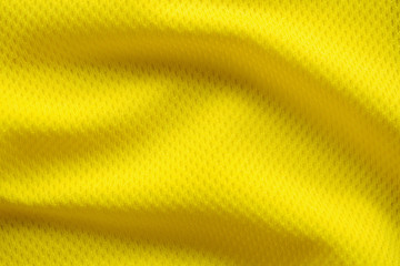 Yellow color football jersey clothing fabric texture sports wear background, close up