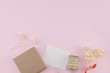 © nathiyai - Blank white card, brown gift box and rope decorate with white dried flowers bouquet on pastel pink background with copy space