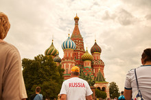 A Man With T-shirt Russia In Front Of St Basil's Cathedral On The Red Square