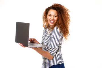 Wall Mural - Happy young woman laughing with laptop bye isolated white background