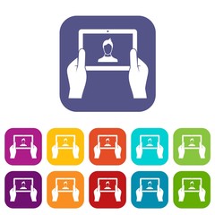 Poster - hands holding tablet icons set vector illustration in flat style in colors red, blue, green, and oth