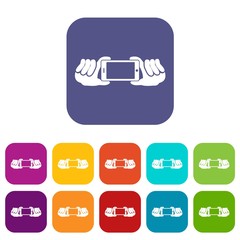 Poster - Two hands holding mobile phone icons set vector illustration in flat style in colors red, blue, green, and other