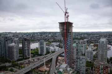 Aerial view of new construction site during a cloudy overcast day. Taken in Vancouver, BC, Canada.